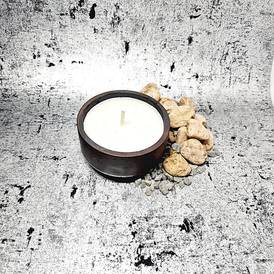 Champagne and rose candle in a concrete jar