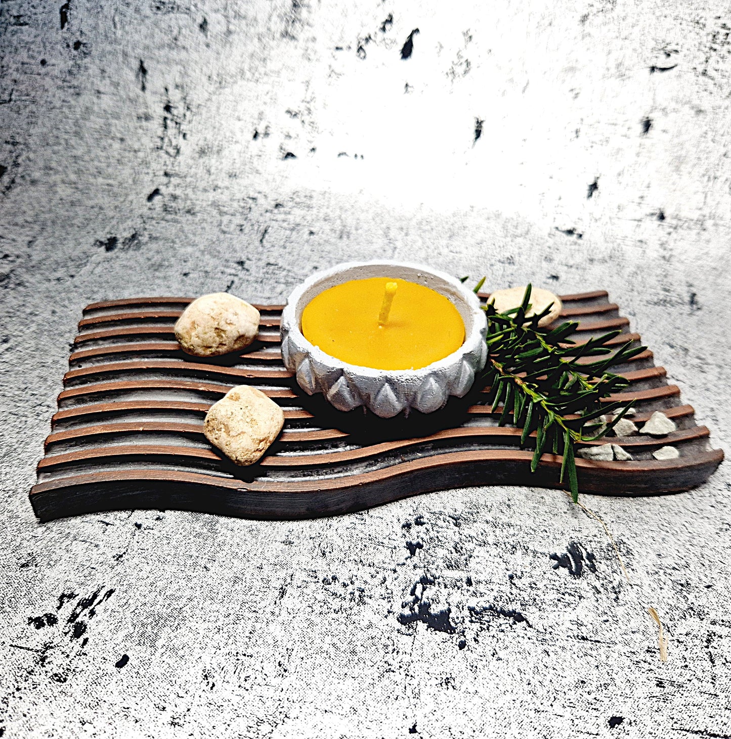 Beeswax candle in a concrete jar