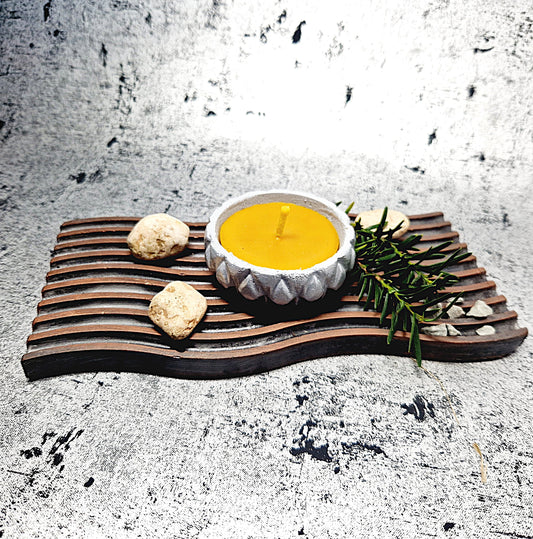 Beeswax candle in a concrete jar