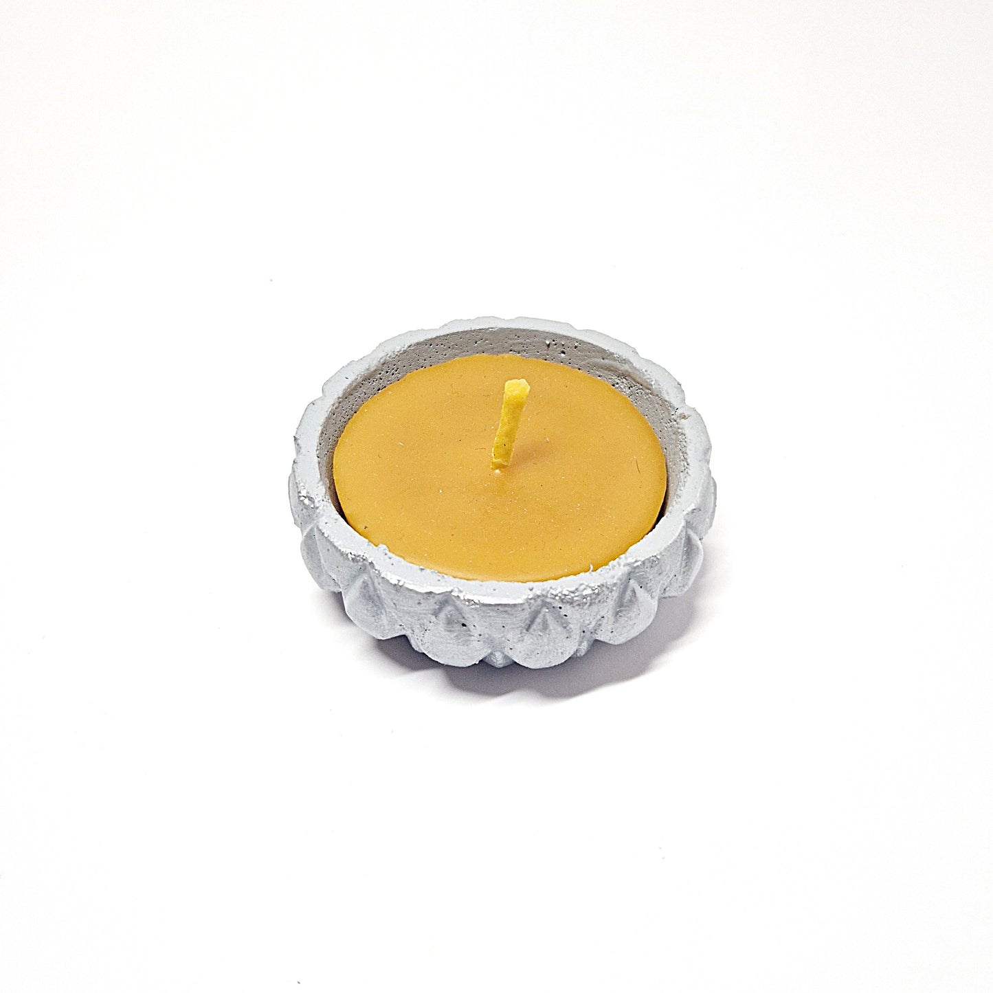 Beeswax candle in a concrete jar