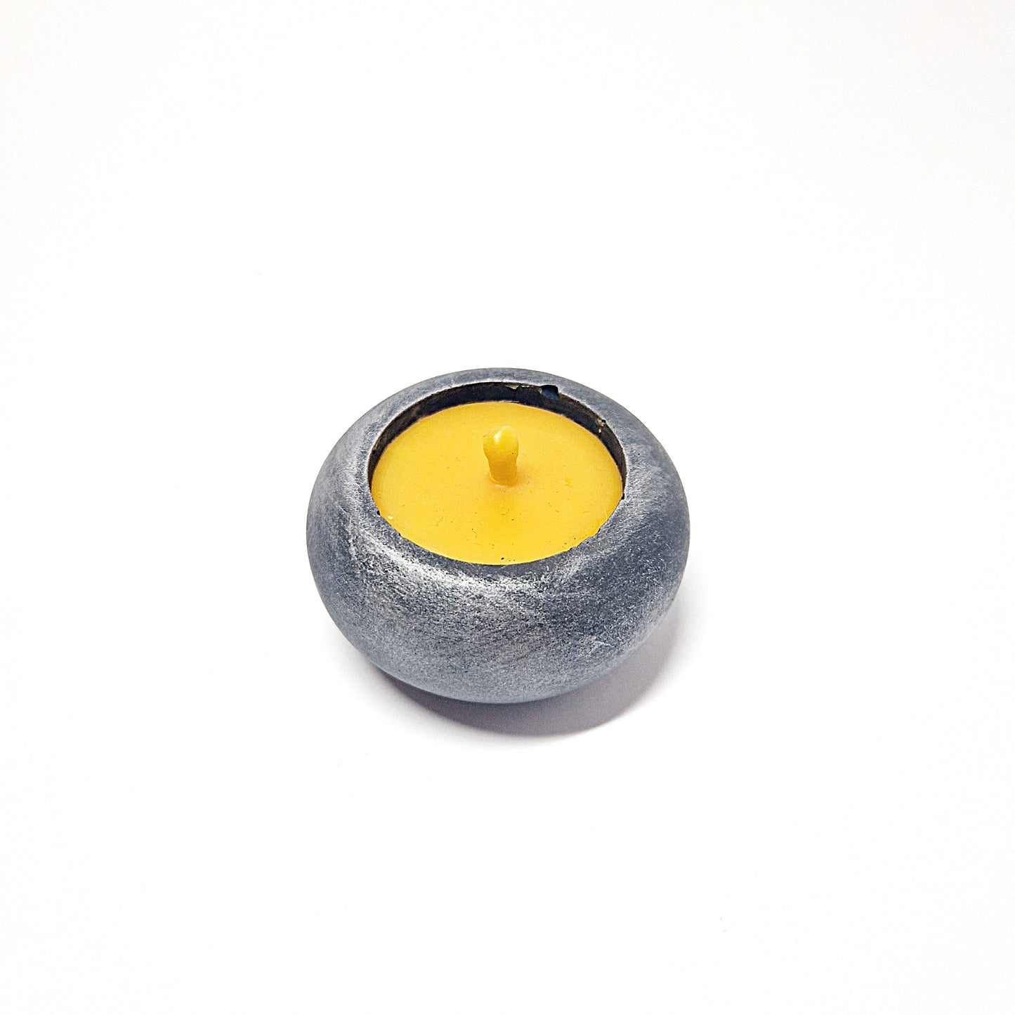 Beeswax candle in a concrete jar